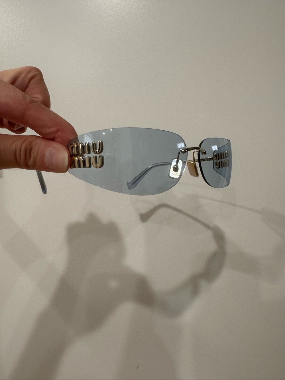 Miu Miu Light Blue Rimless Sunglasses with Gold Logo Accents